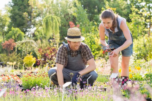 Gardeners Neasden sorting green waste for recycling