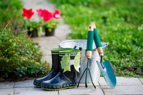 Local gardeners in Neasden trimming hedges and borders